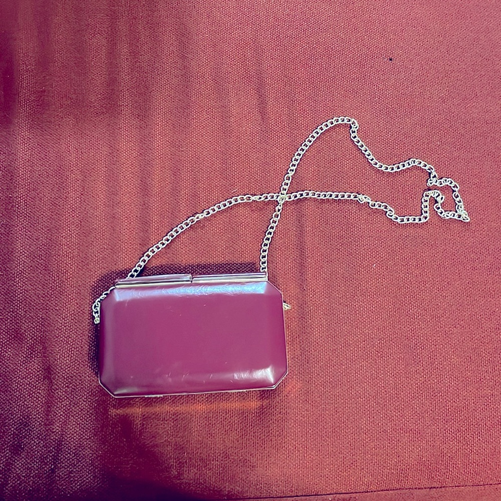 Small clutch with gold detachable chain